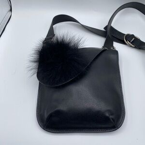 Black leather crossbody bag w flap closure and faux fur ball NWOT
